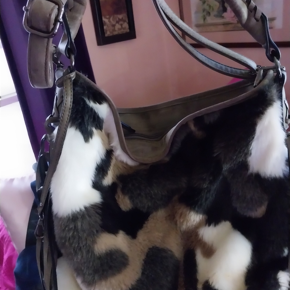 A brand new faux fur/sued handbag!